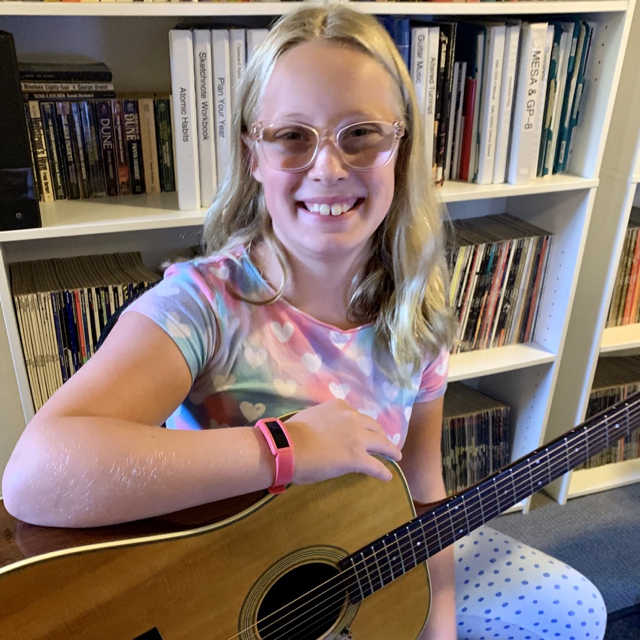 Grace enjoys playing guitar.